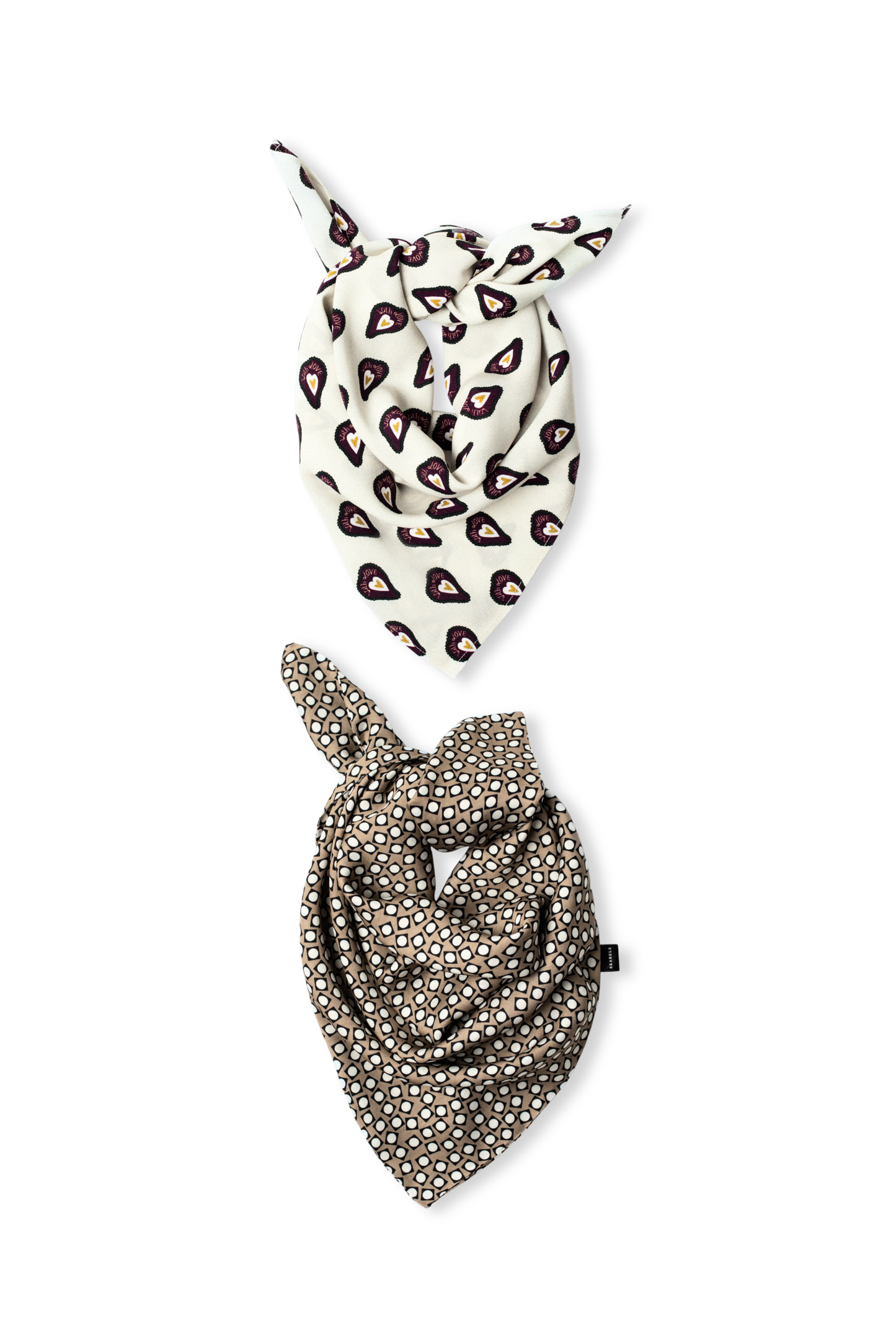 Two patterned viscose scarves artfully knotted on a white background: one featuring a cream base with dark heart shapes, and another in a taupe shade with a white geometric circle print.