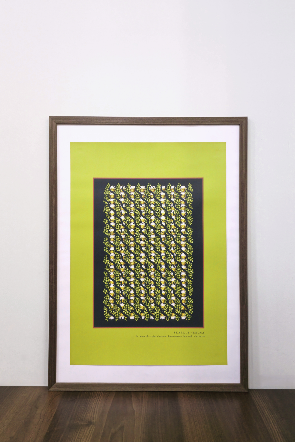 Framed pistachio green digital poster in a dark wooden frame displayed on a wooden surface against a white wall