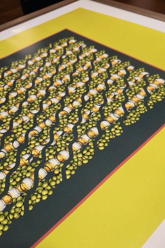 Perspective view close-up of the "Evening pistachio green" art print, highlighting the high-quality print finish, dark grey center with green grapes and cocktail pattern, set within a wood frame
