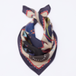 Flat lay view of the GUARDIAN Silk Scarf in Blue Graphite, showcasing its modern artistic print and terrier dog theme. The design combines sophisticated dark blue tones with playful abstract elements and sketches. Woven from premium silk, this accessory highlights a balance of classic style and whimsical art, making it a unique gift for dog lovers and fashion enthusiasts.