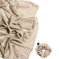 A luxury silk accessory set featuring a large draped scarf and a matching mid-size scrunchie with a neutral rattan cane weave pattern on a white background.