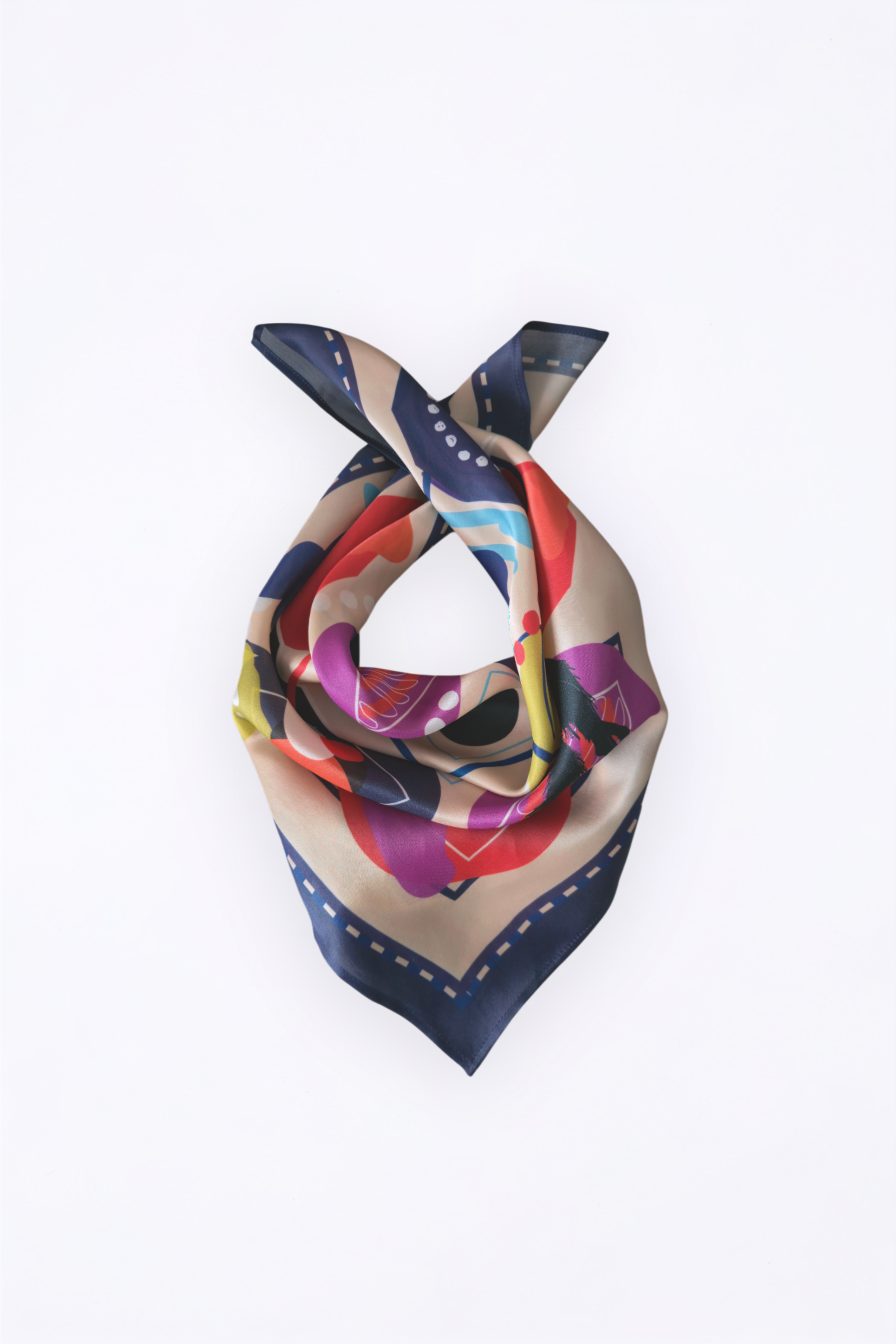 Elegant draped Borzoi Edition silk scarf tied in a loop. Features a cream base with vibrant abstract geometric prints and a dark blue purple dashed border on a clean white background.