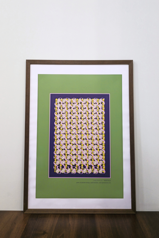 interior mockup of the "Movement citrus yellow" digital poster framed in a thin dark wooden frame with a white passe-partout mat, featuring padel rackets and  balls pattern, resting on a wooden table against a clean white wall.