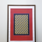 Interior mockup of the "Movement dynamic blue" digital poster framed in a thin dark wooden frame with a white passe-partout mat, featuring tennis rackets and tennis balls pattern on a deep red background, resting on a wooden table against a clean white wall