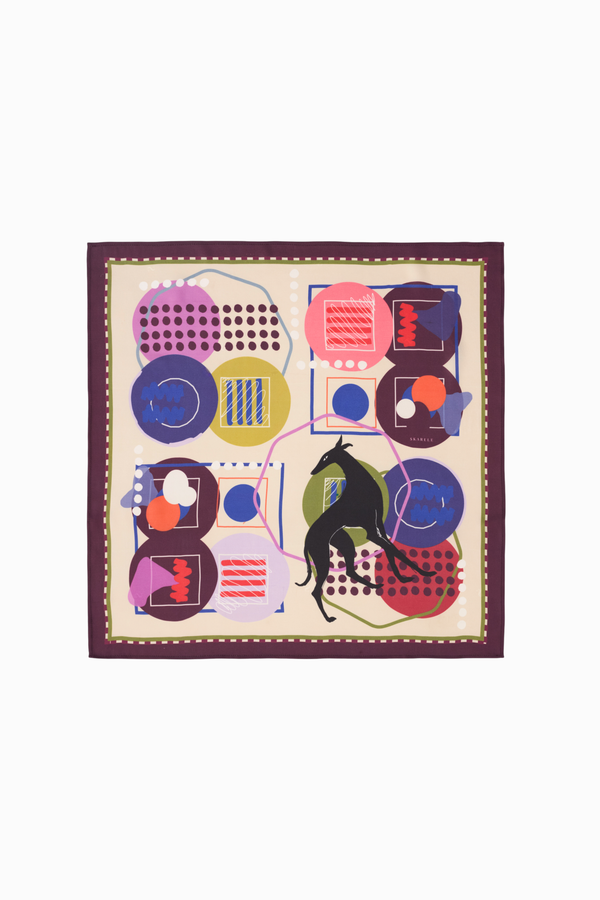 Full view of the NOMAD Silk Scarf in Velvet Plum, showcasing the complete "Nomad" collection print. The design features a stylized sighthound illustration surrounded by mid-century modern geometric patterns and whimsical line art. The bold contrast between the deep purple edges and the vibrant multi-colored interior highlights the scarf's premium artistic value, ideal for dog lovers and fashion enthusiasts alike