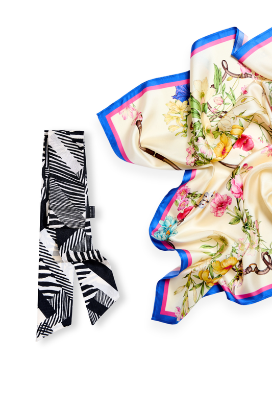 Floral scarf with colorful border and black and white striped narrow silk scar on a white background