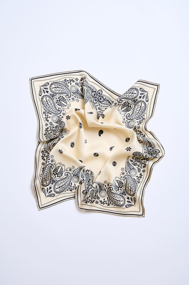 A beige and black bandana-style viscose scarf laid out flat with paisley patterns.