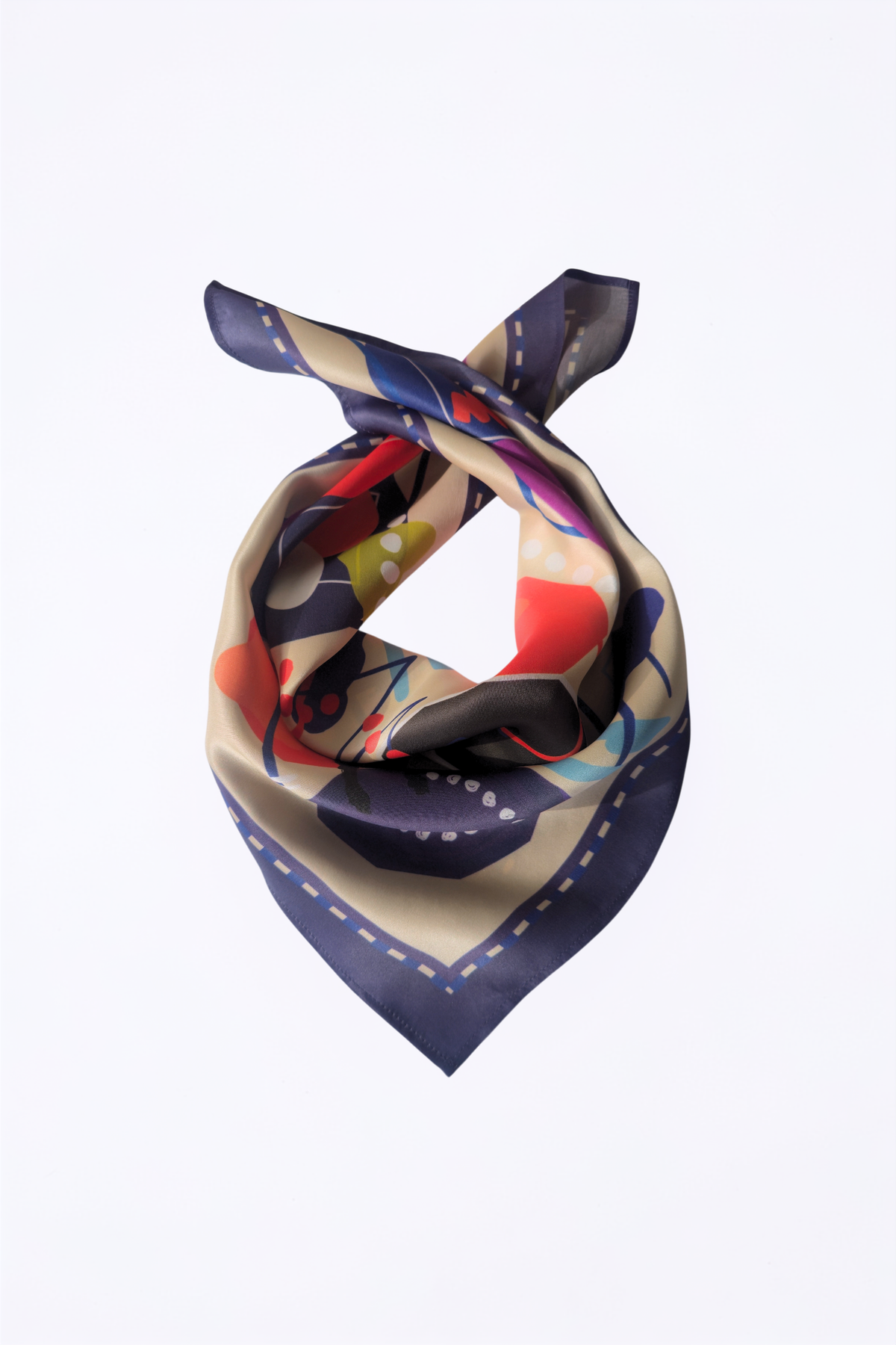 A square silk scarf with an abstract pattern, tied in a knot against a plain white background. The scarf features a navy blue border and a multicolor interior with beige, red, blue, and yellow shapes.