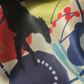 A close-up of a printed silk scartf with an abstract multicolor design featuring a black borzoi silhouette, red dots, blue and yellow shapes, and a cream base.