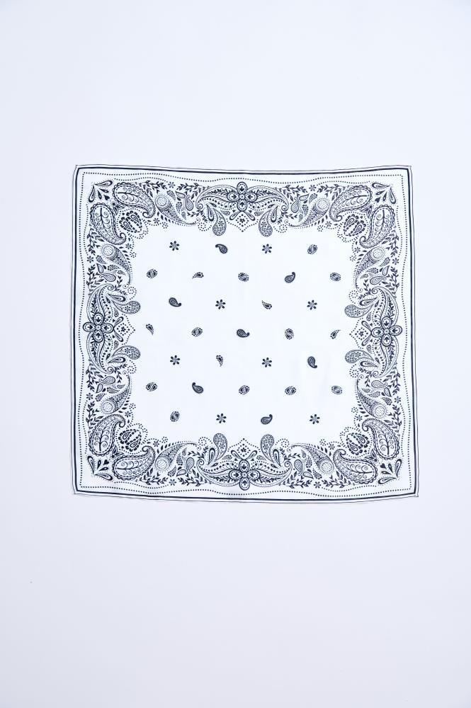 A fully spread-out square white scarf against a white background. The accessory features a symmetrical, classic black paisley pattern, which is most dense along all four edges, forming a decorative border. Smaller motifs of the same style and flower elements are scattered throughout the center of the scarf.