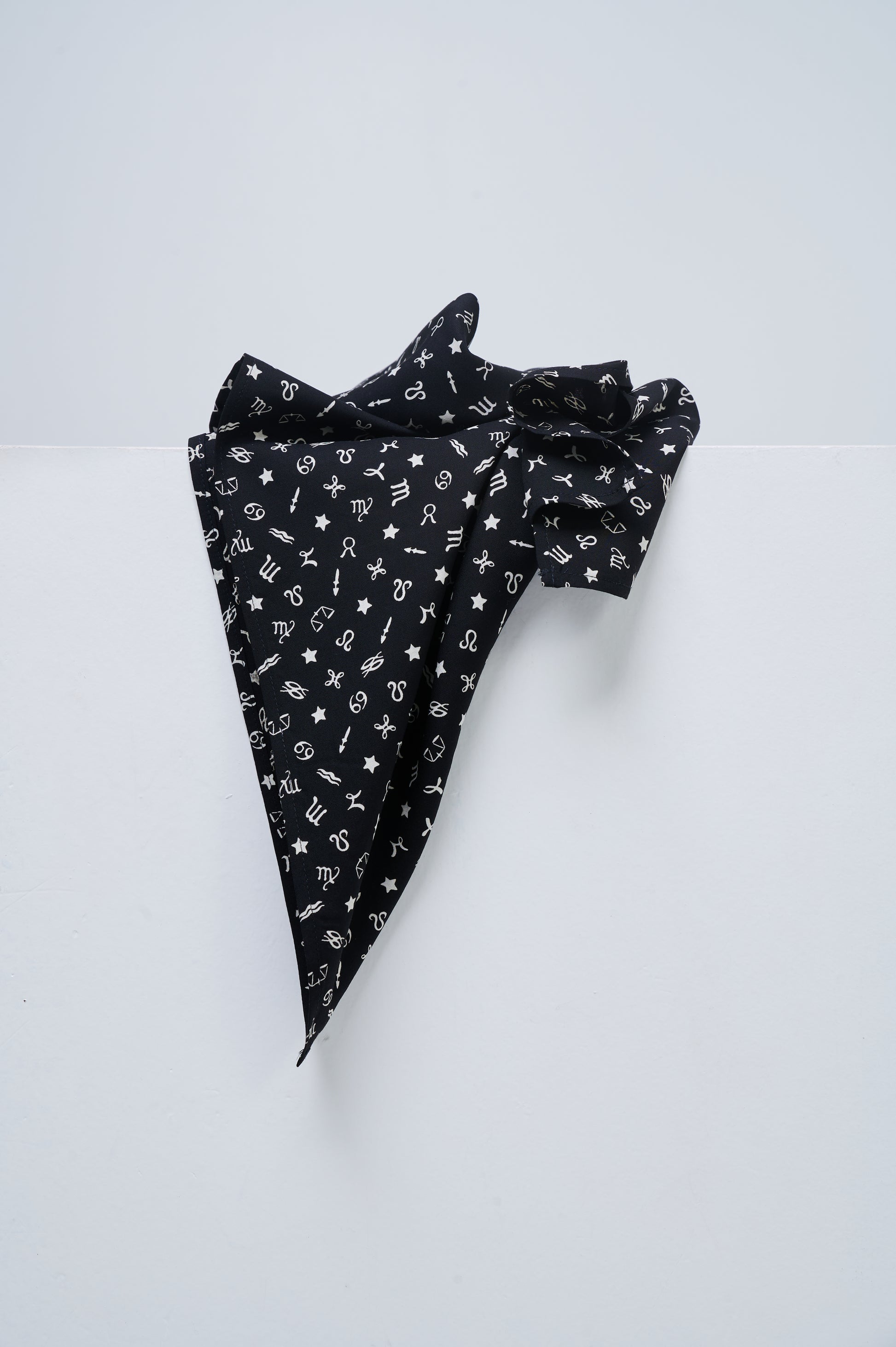 Black fabric with white patterns on a white background
