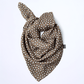 Studio product shot of Skarele TONE viscose scarffolded on a solid white background. Features a beige and dark brown geometric retro dot print pattern.