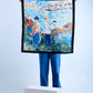 A person standing on a platform holding a silk scarf with a vibrant French Impressionist design.