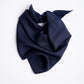 Navy blue silk scarf, minimalist studio product photography on a clean white backdrop, perfect for elegant styling.